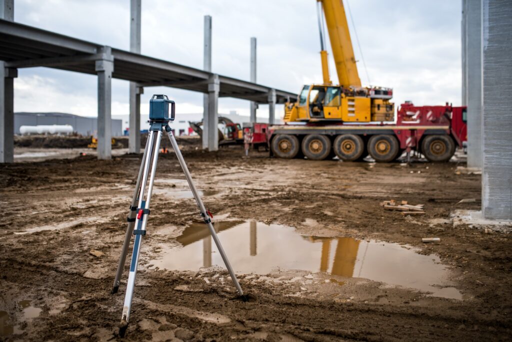 Industrial engineering with theodolite, gps, total station and tools at construction site